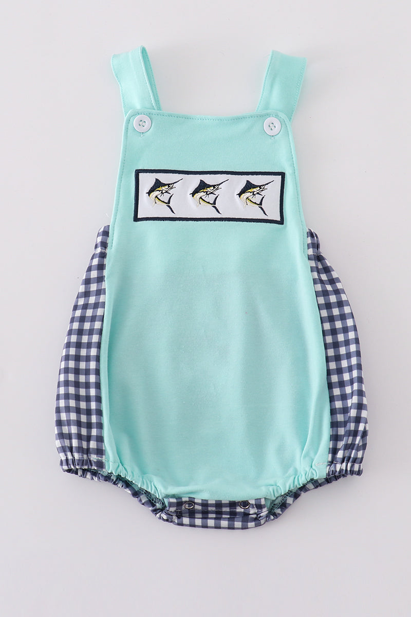 Blue bubble with navy gingham sides and back and smocked with 3 swordfish