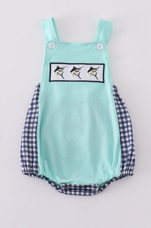 Blue bubble with navy gingham sides and back and smocked with 3 swordfish