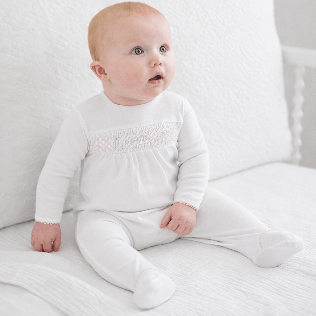 White Smocked Footie – Pink Trim