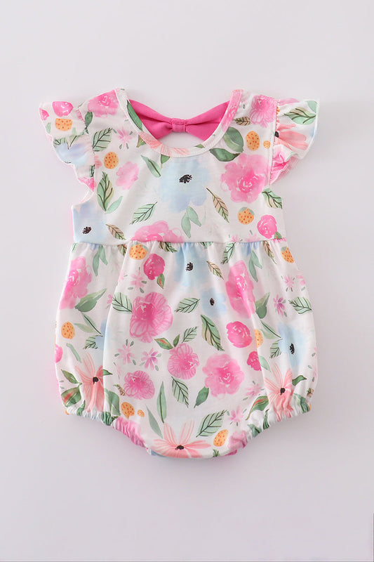 Romper with pink and blue flowers and pink bow at the neck in the back