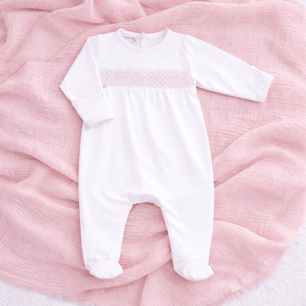 White Smocked Footie – Pink Trim